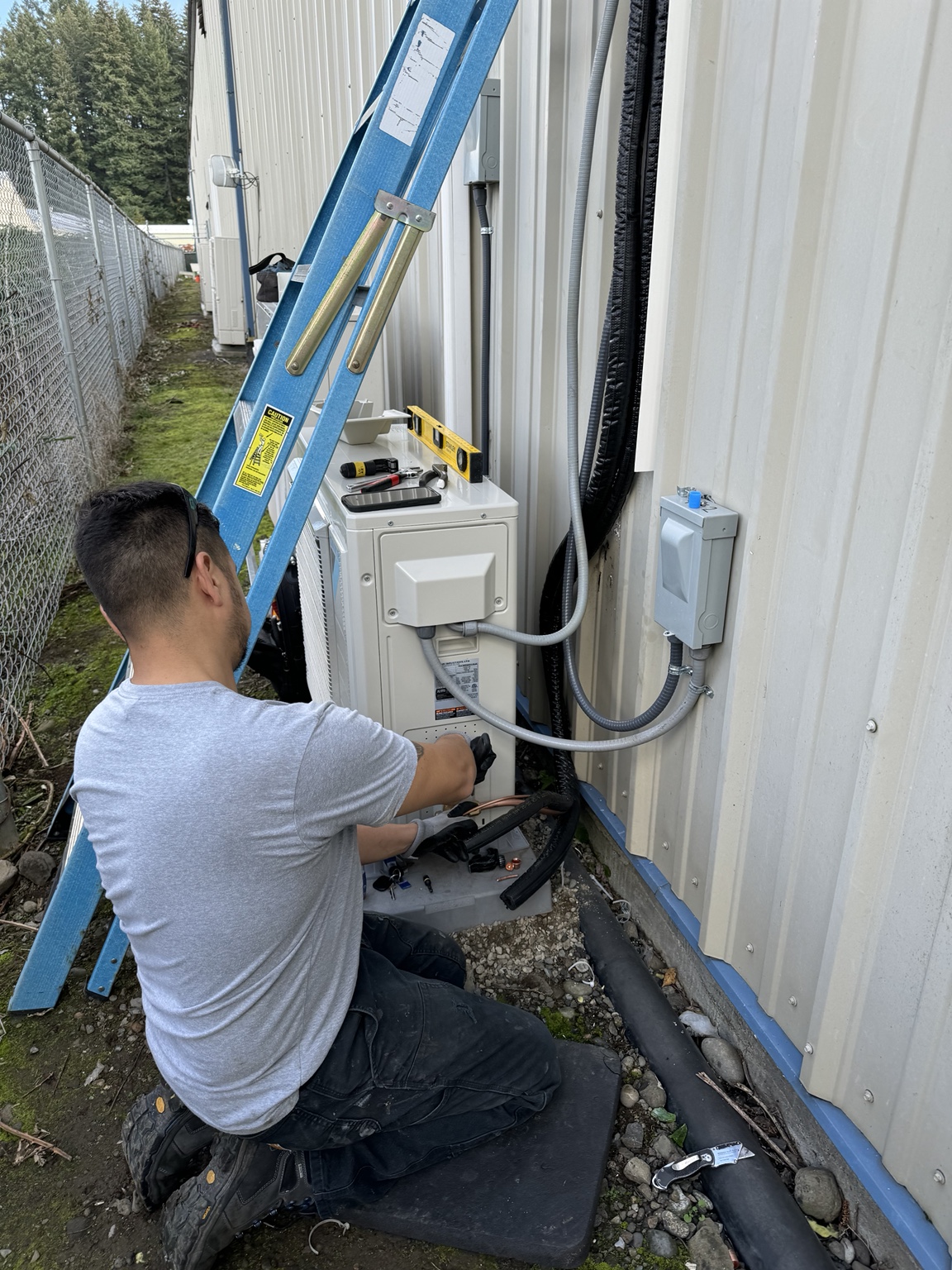 Tranquility contractor installing a heat pump